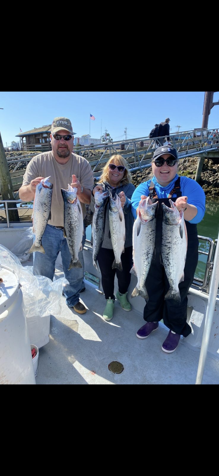 Derek Maida and crew holding their salmon limit at the dock